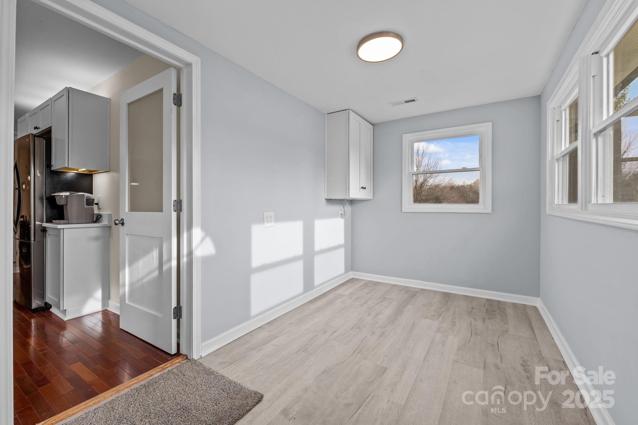 2337 Belmont Road Linwood, NC 27299 - Photo 17 of 46 a view of a room with wooden floor and a bathroom