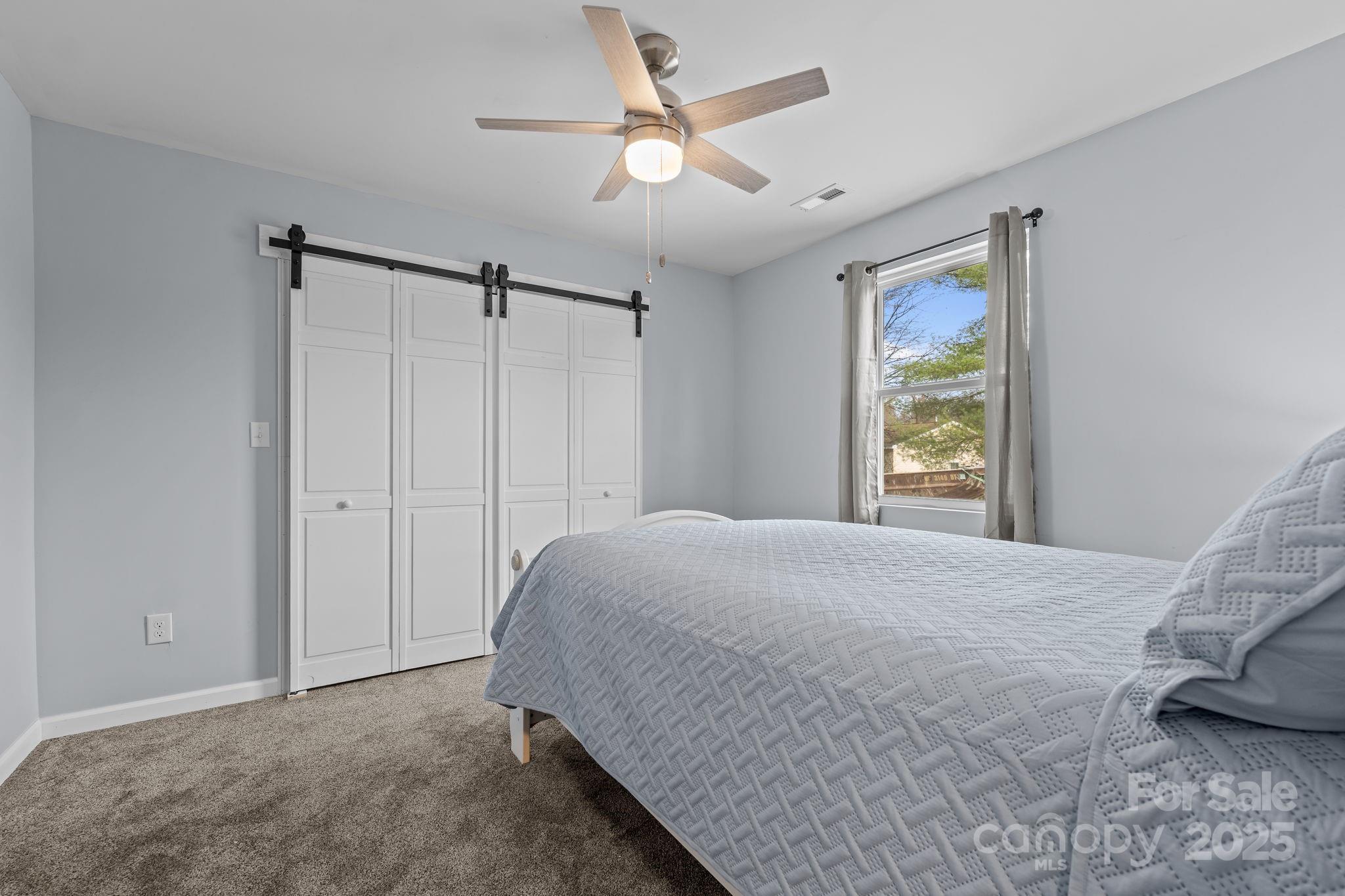2337 Belmont Road Linwood, NC 27299 - Photo 20 of 46 a bedroom with a bed and a window