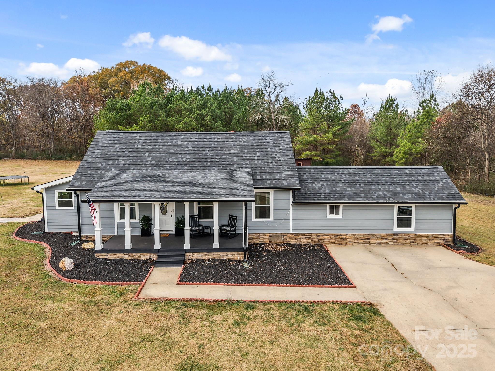 2337 Belmont Road Linwood, NC 27299 - Photo 2 of 46 a front view of a house with a yard