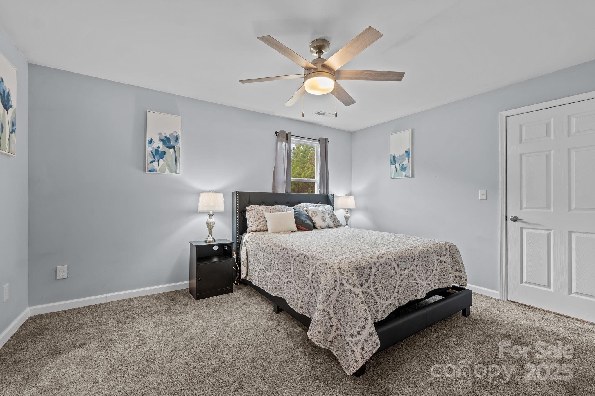 2337 Belmont Road Linwood, NC 27299 - Photo 23 of 46 a spacious bedroom with a bed and window