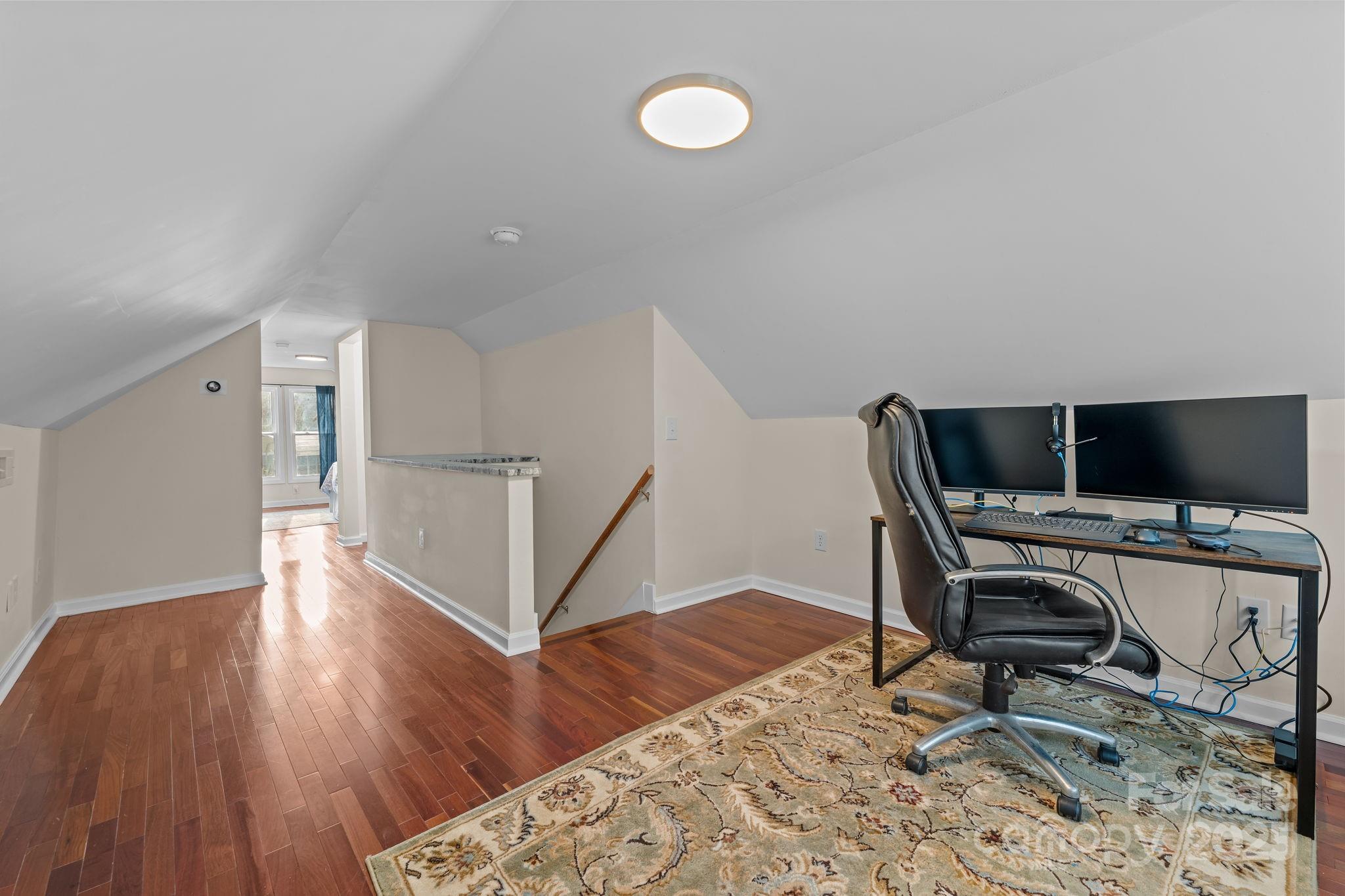 2337 Belmont Road Linwood, NC 27299 - Photo 29 of 46 a view of a workspace with furniture and a window