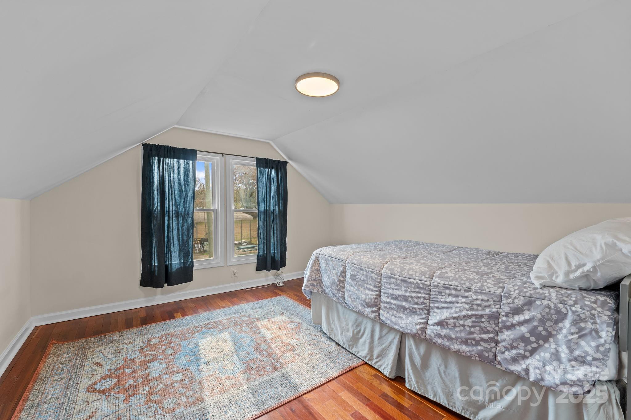 2337 Belmont Road Linwood, NC 27299 - Photo 30 of 46 a bedroom with a bed and a large window