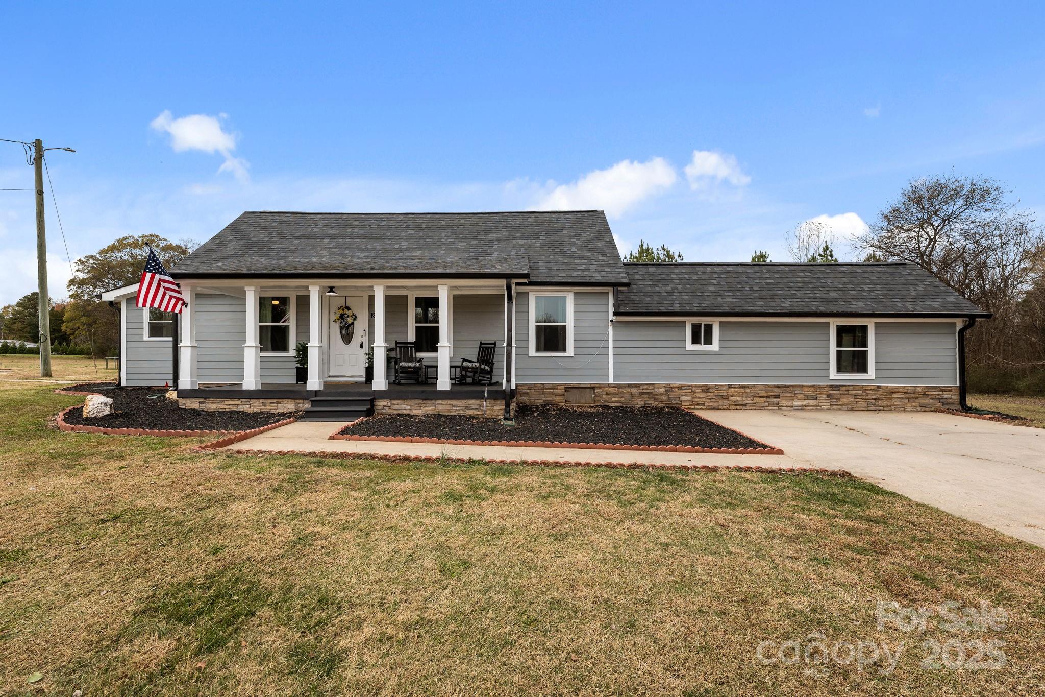 2337 Belmont Road Linwood, NC 27299 - Photo 3 of 46 front view of a house with a patio