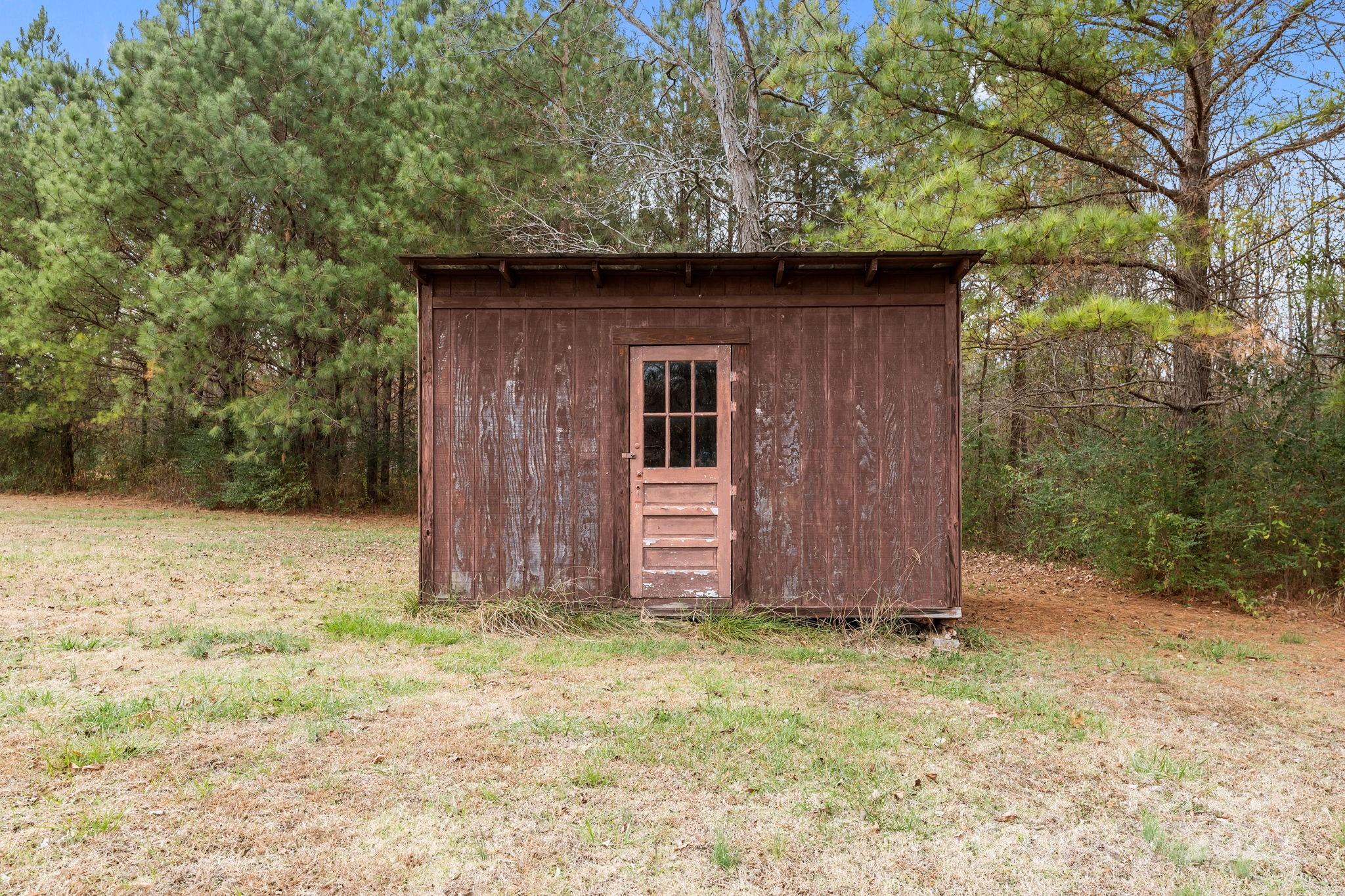 2337 Belmont Road Linwood, NC 27299 - Photo 32 of 46 a wooden door in front of a house