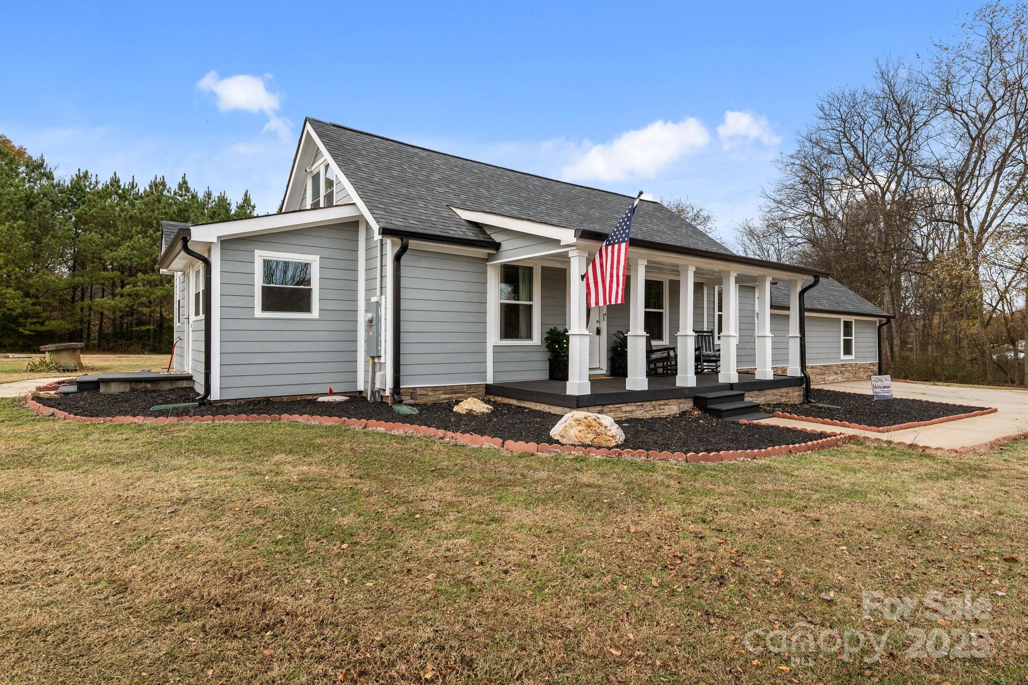 2337 Belmont Road Linwood, NC 27299 - Photo 34 of 46 a view of a house with backyard and trees