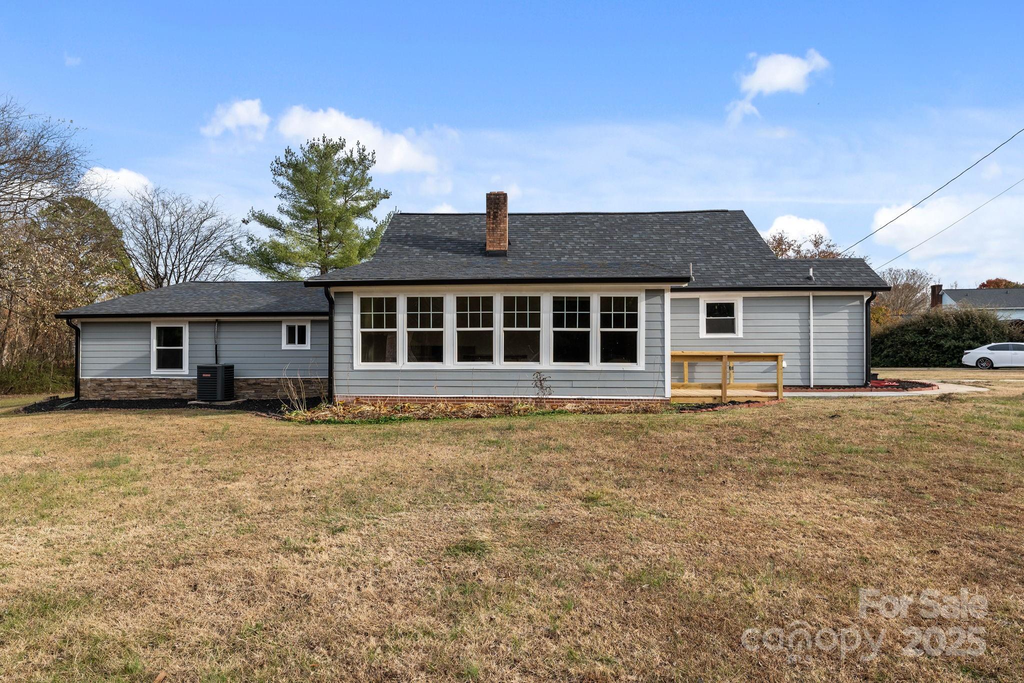 2337 Belmont Road Linwood, NC 27299 - Photo 36 of 46 a front view of a house with a garden