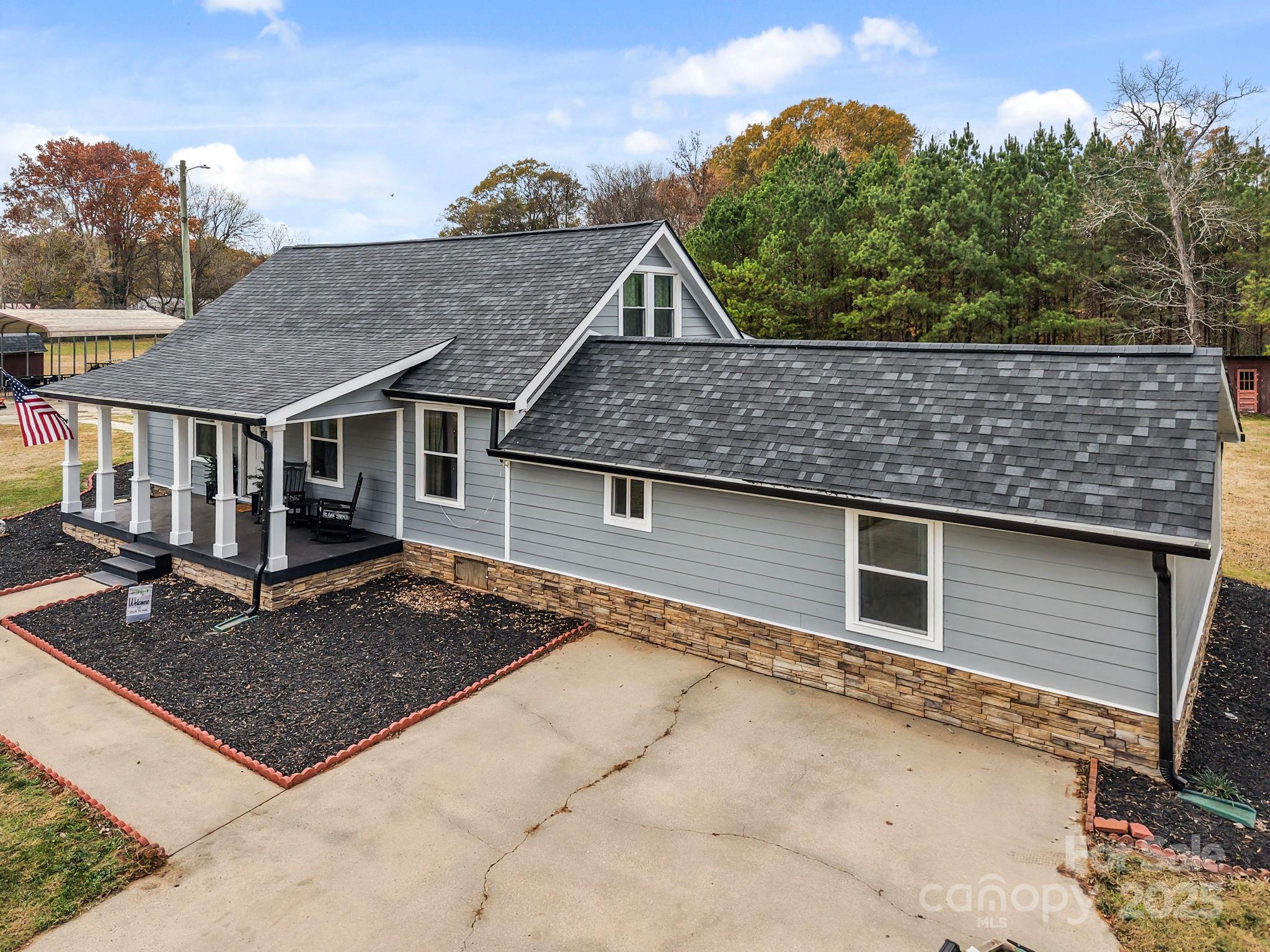 2337 Belmont Road Linwood, NC 27299 - Photo 37 of 46 a view of a house with a yard