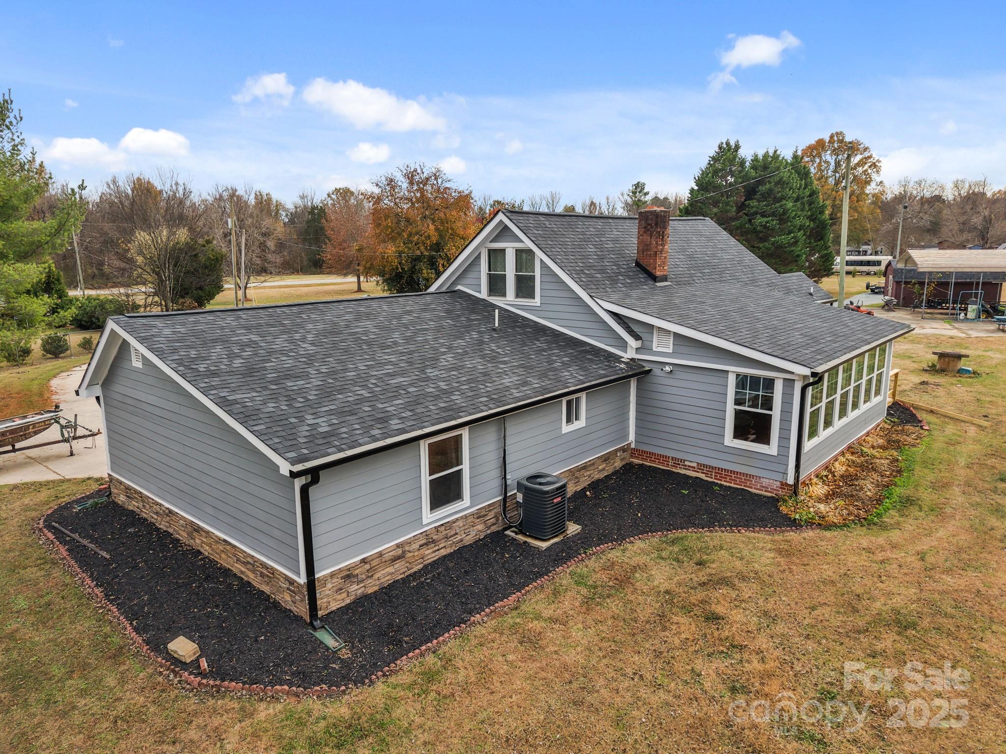2337 Belmont Road Linwood, NC 27299 - Photo 38 of 46 a aerial view of a house in a big yard
