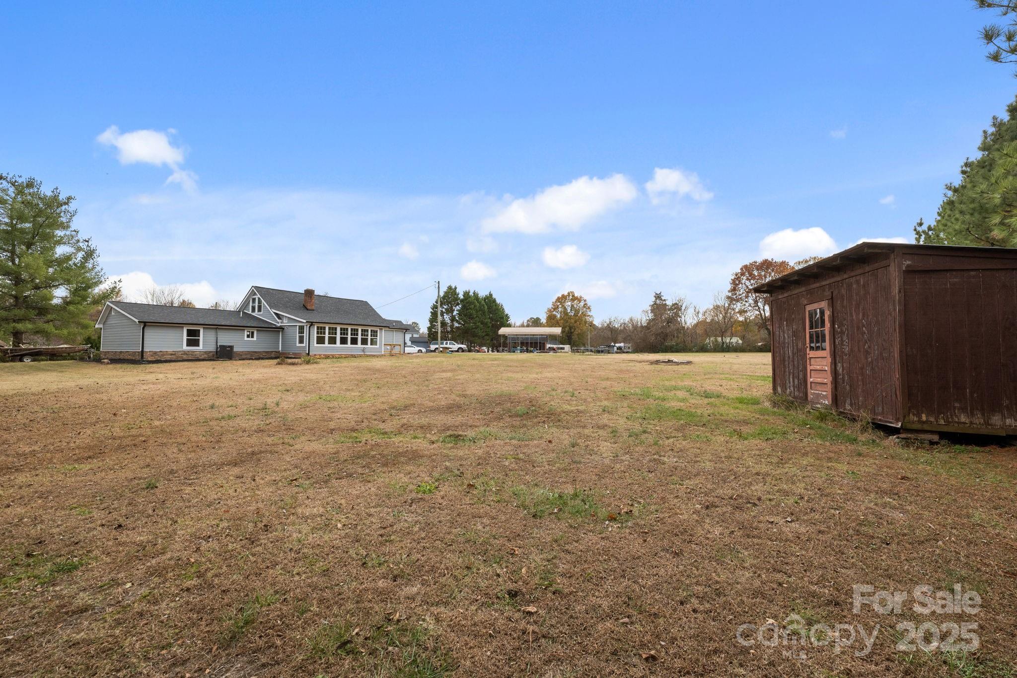 2337 Belmont Road Linwood, NC 27299 - Photo 41 of 46 a view of a house with a yard