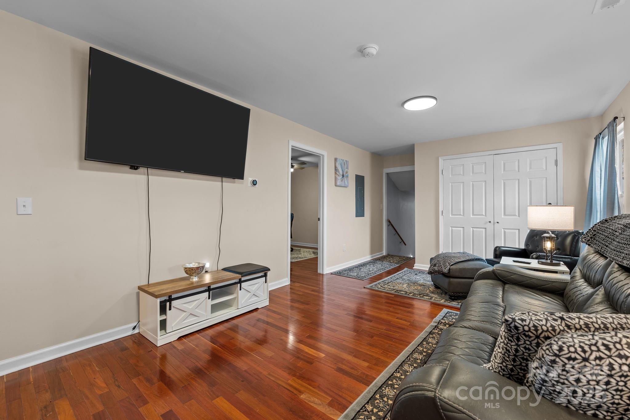 2337 Belmont Road Linwood, NC 27299 - Photo 6 of 46 a living room with furniture and a flat screen tv