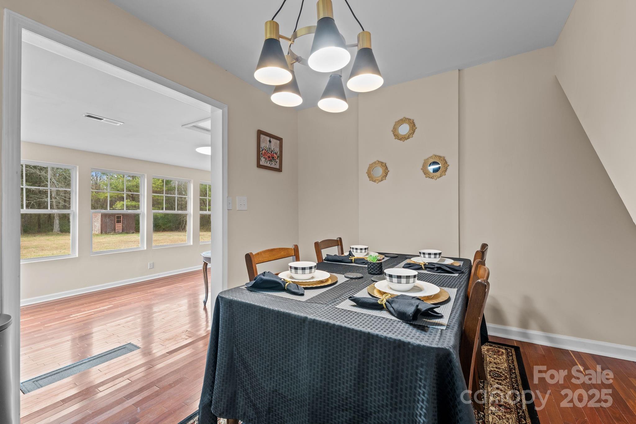 2337 Belmont Road Linwood, NC 27299 - Photo 10 of 46 a view of a dining room with furniture and a large window