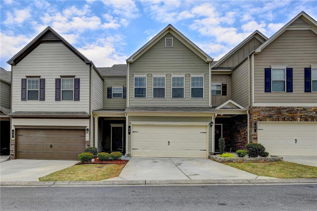 39 Crescent Chase Dallas, GA 30157 - Photo 1 of 1 a front view of a house with a yard and garage