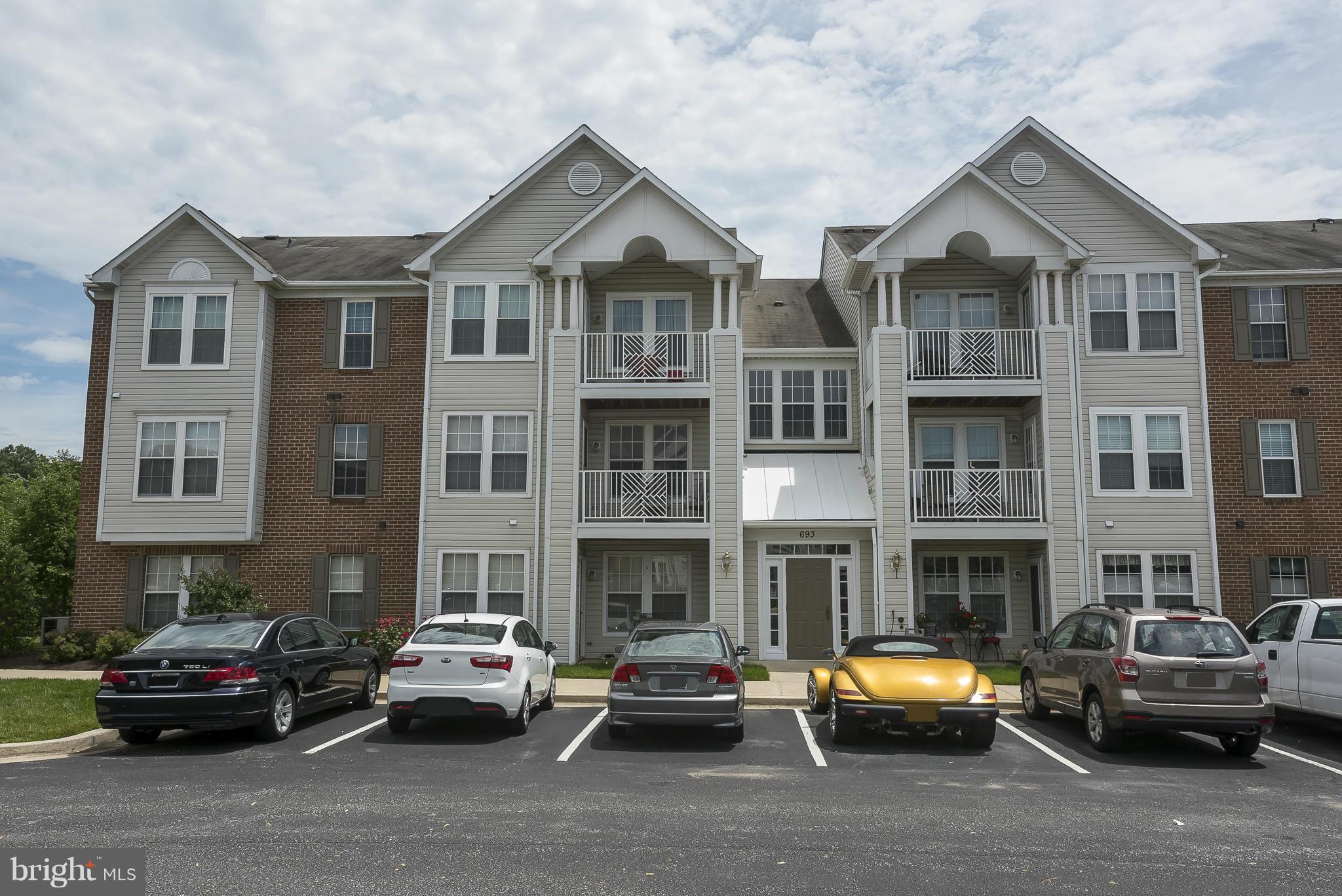 693 Winding Stream Way, Unit 201 Odenton, MD 21113 - Photo 1 of 28 a car parked in front of a big house