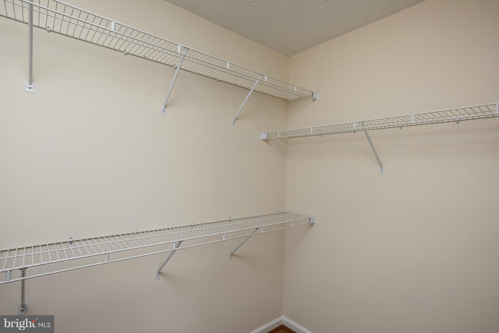 693 Winding Stream Way, Unit 201 Odenton, MD 21113 - Photo 15 of 28 a view of a room with racks on the wall