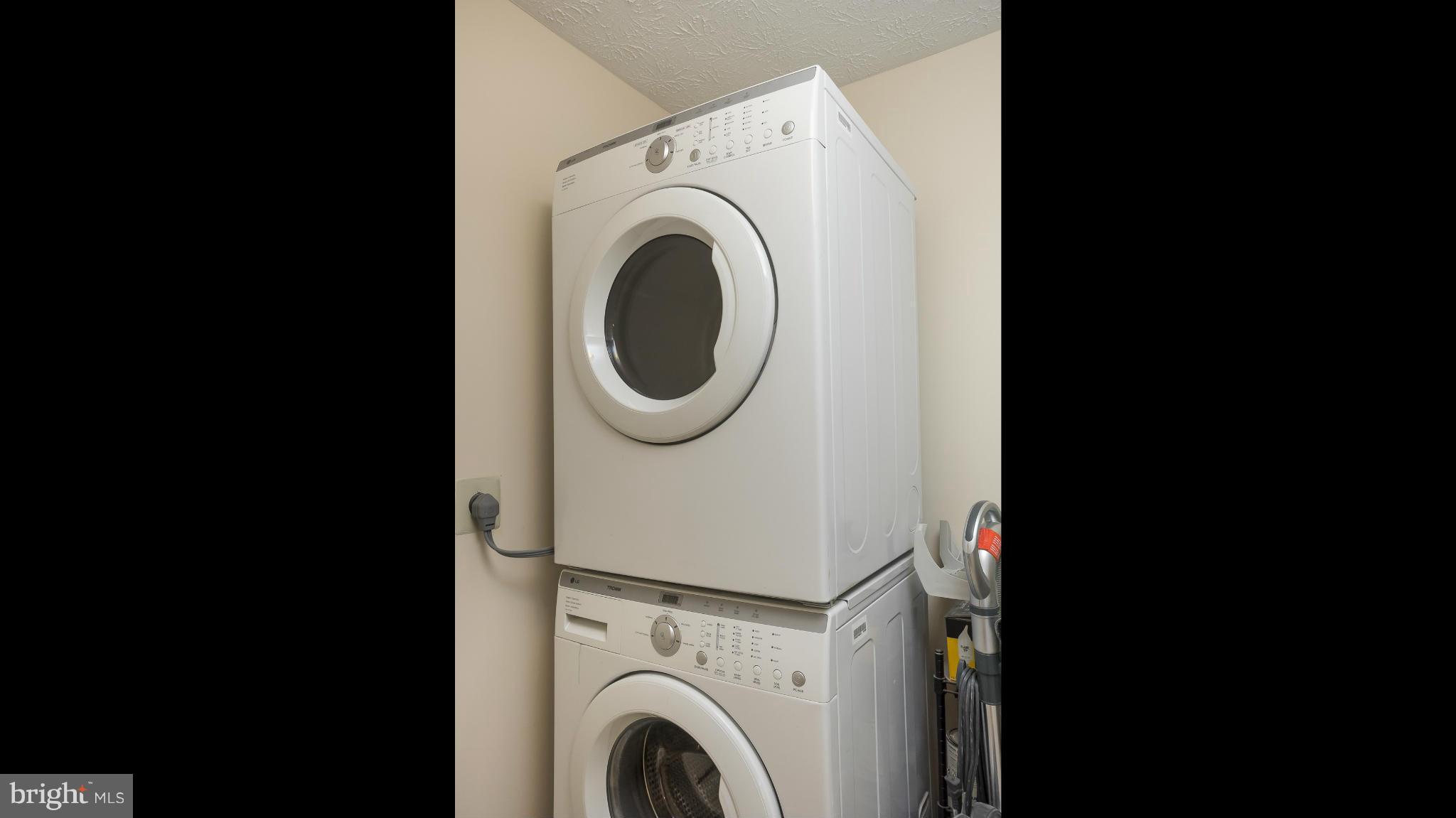 693 Winding Stream Way, Unit 201 Odenton, MD 21113 - Photo 19 of 28 a utility room with dryer and washer