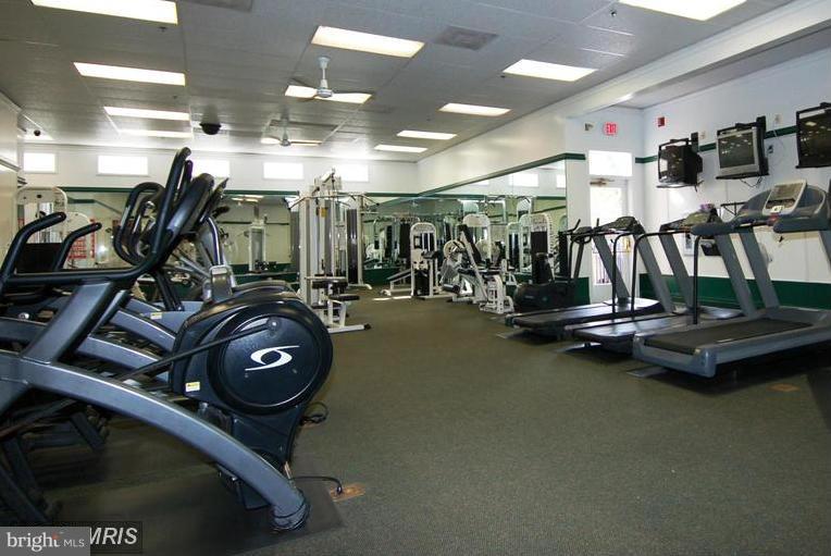 693 Winding Stream Way, Unit 201 Odenton, MD 21113 - Photo 24 of 28 a view of a room with gym equipment