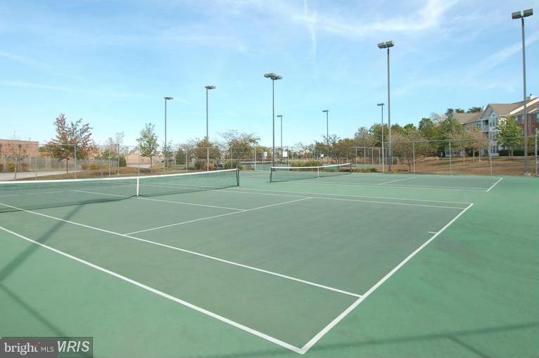 693 Winding Stream Way, Unit 201 Odenton, MD 21113 - Photo 28 of 28 a view of an outdoor space and tennis court