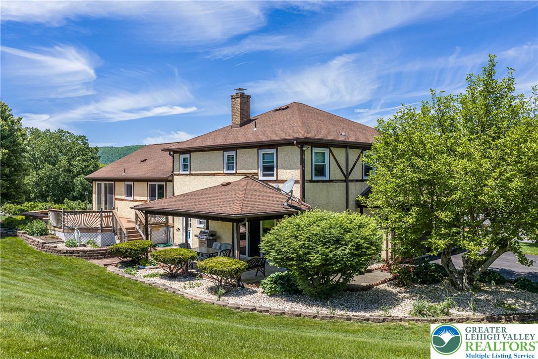 947 Tamenend Road Bath, PA 18014 - Photo 49 of 61 Perched on a grassy hillside, this home offers multiple outdoor entertaining areas and a large deck.
