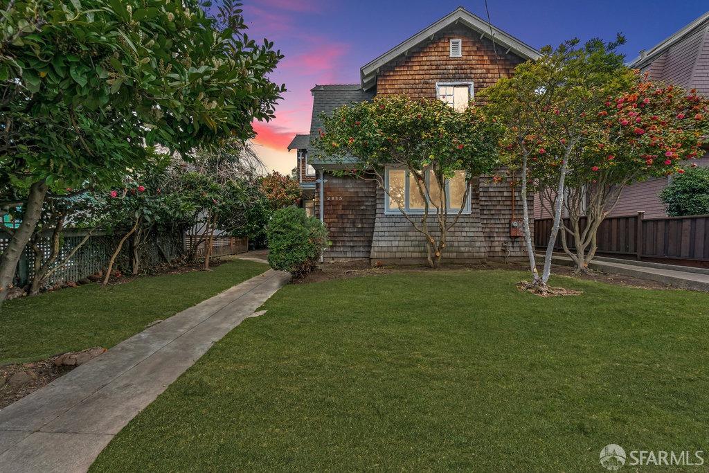 a front view of a house with garden