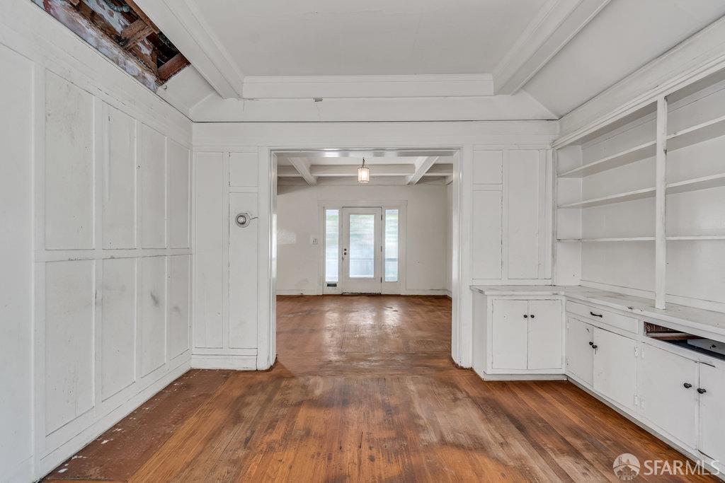 2815 Ashby Avenue Berkeley, CA 94705 - Photo 15 of 57 a view of empty room with wooden floor and cabinet