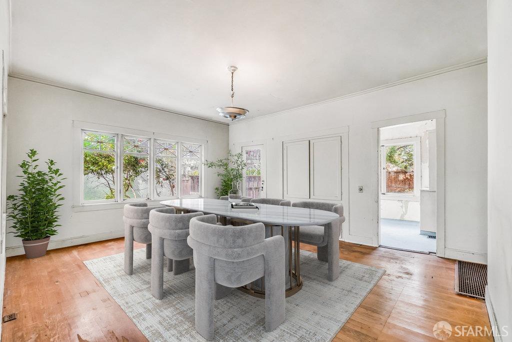2815 Ashby Avenue Berkeley, CA 94705 - Photo 18 of 57 a view of a dining room with furniture window and wooden floor