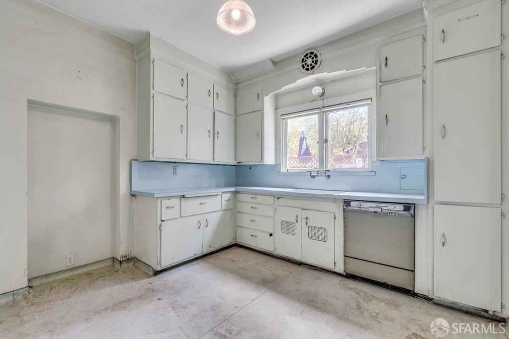 2815 Ashby Avenue Berkeley, CA 94705 - Photo 20 of 57 a kitchen with granite countertop white cabinets and white appliances