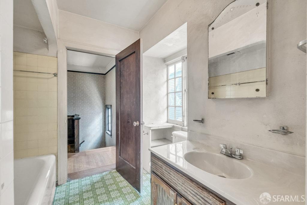 2815 Ashby Avenue Berkeley, CA 94705 - Photo 38 of 57 a bathroom with a sink and a mirror