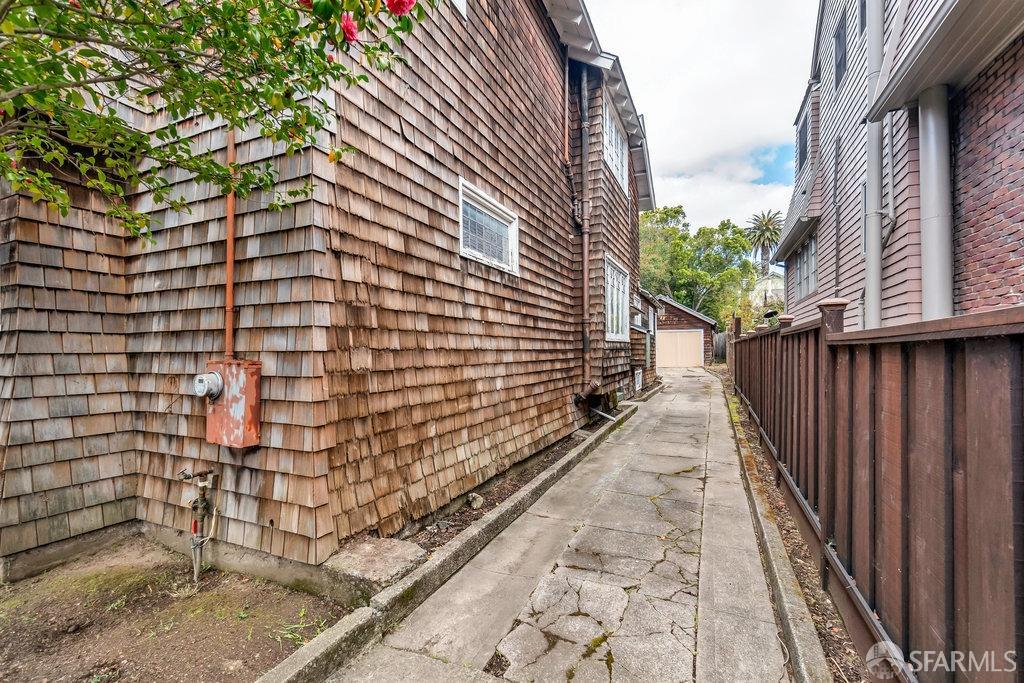 2815 Ashby Avenue Berkeley, CA 94705 - Photo 50 of 57 a pathway of a brick house with wooden fence