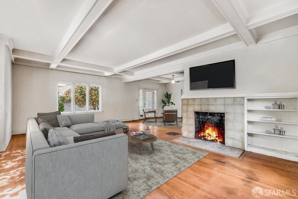 2815 Ashby Avenue Berkeley, CA 94705 - Photo 6 of 57 a living room with furniture a flat screen tv and a fireplace