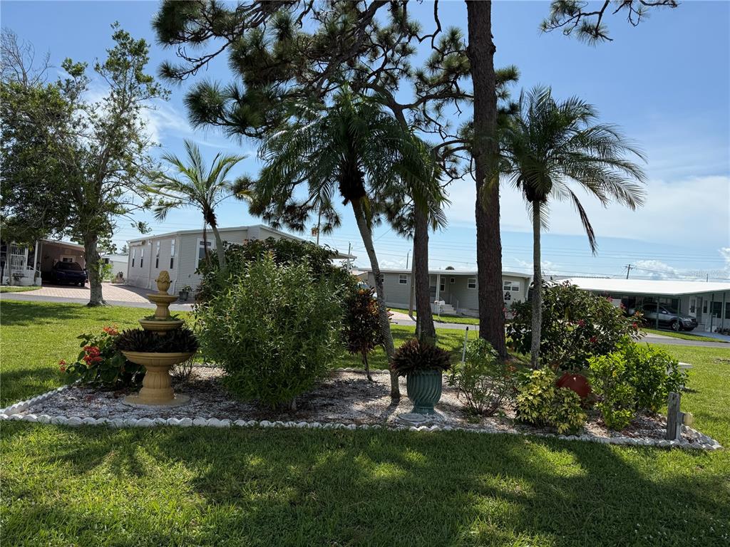 231 Inner Drive East Venice, FL 34285 - Photo 12 of 13 a view of a garden with a tree