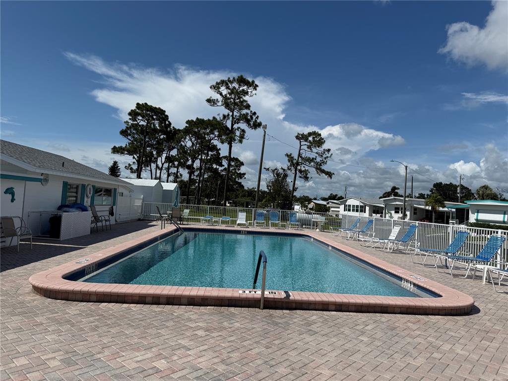 231 Inner Drive East Venice, FL 34285 - Photo 4 of 13 a view of a swimming pool with outdoor seating