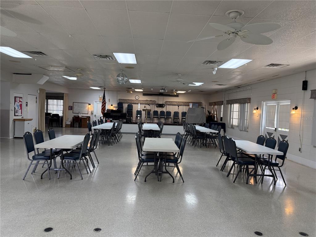 231 Inner Drive East Venice, FL 34285 - Photo 5 of 13 a group of people sitting at kitchen in a room