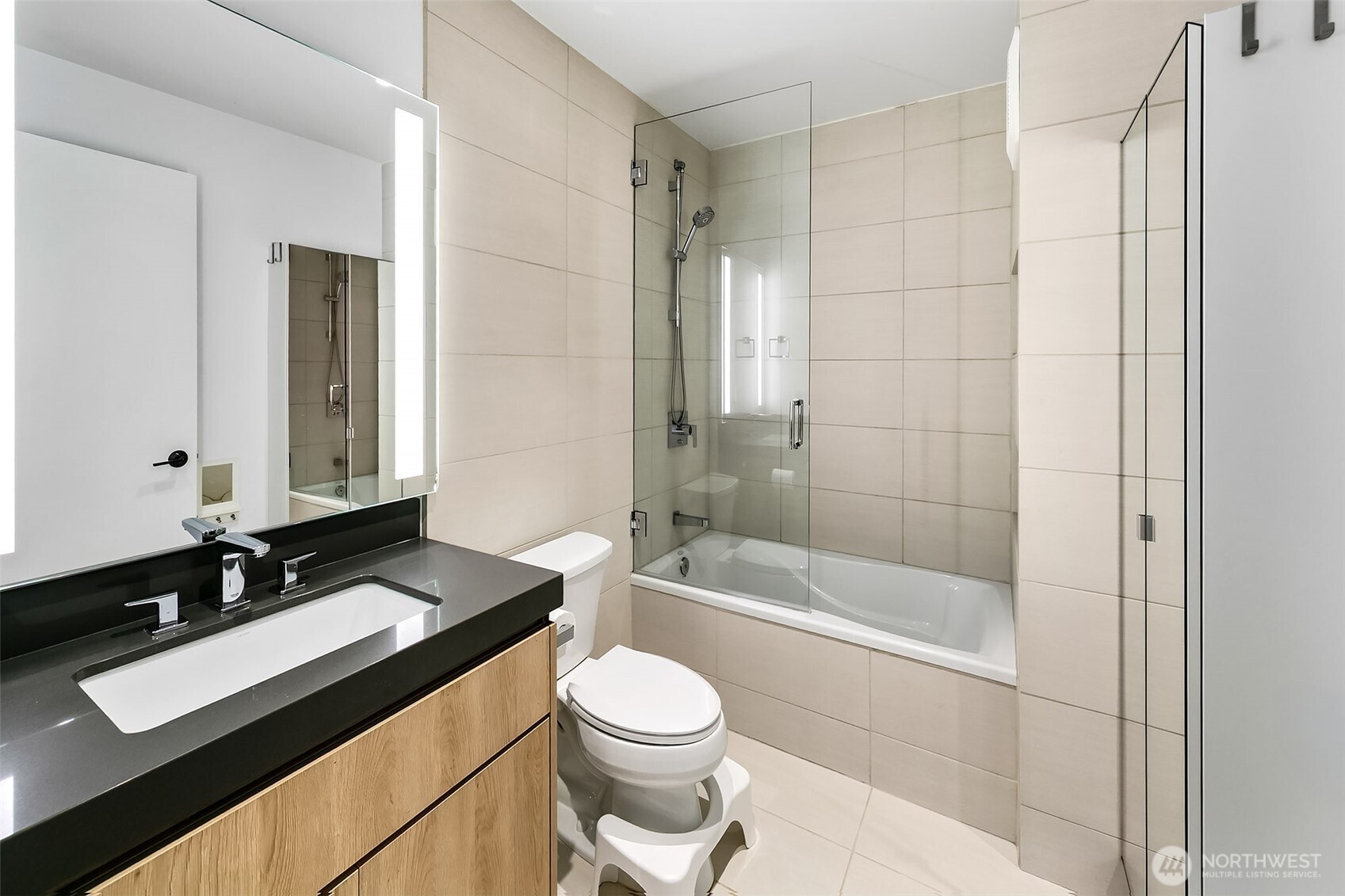 7538 Moon Valley Road Southeast North Bend, WA 98045 - Photo 33 of 40 a bathroom with a sink a toilet a mirror and shower