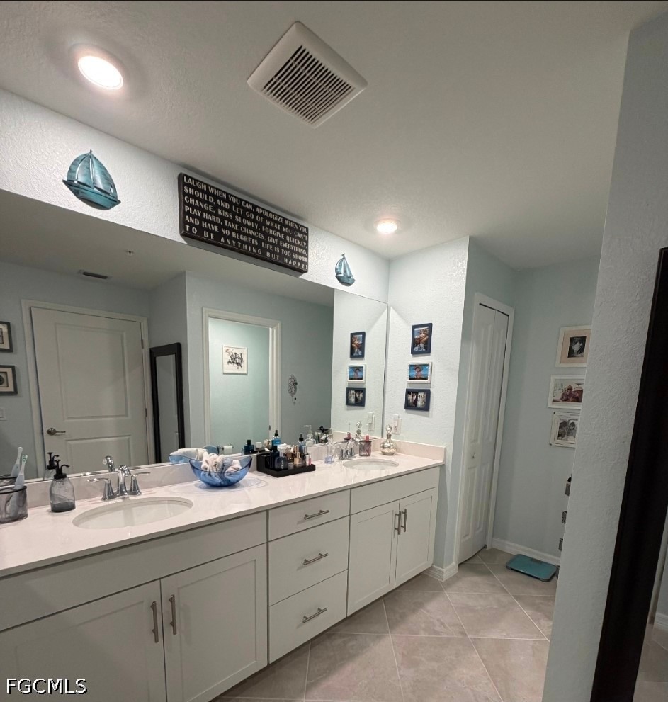 14191 Poppy Fld Loop, Unit 5312 Punta Gorda, FL 33955 - Photo 20 of 41 a spacious bathroom with a double vanity sink mirror and double