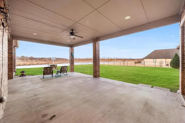 a view of a house with a yard and table