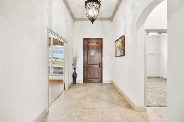 a view of a hallway with wooden shelves