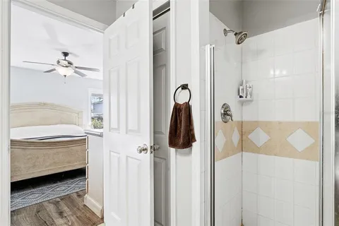 a bathroom with a tub sink and mirror