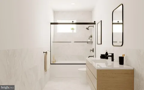 a bathroom with a sink a mirror and shower