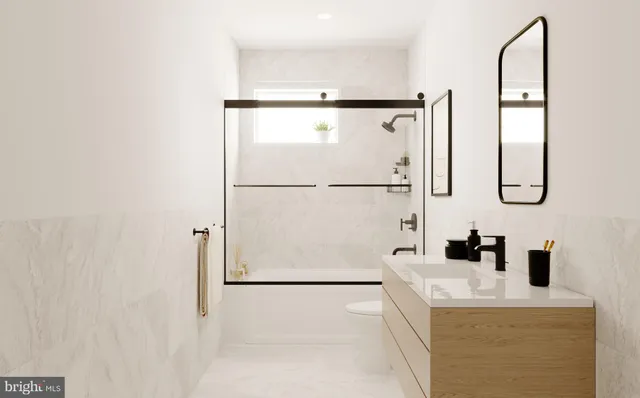 a bathroom with a sink a mirror and shower