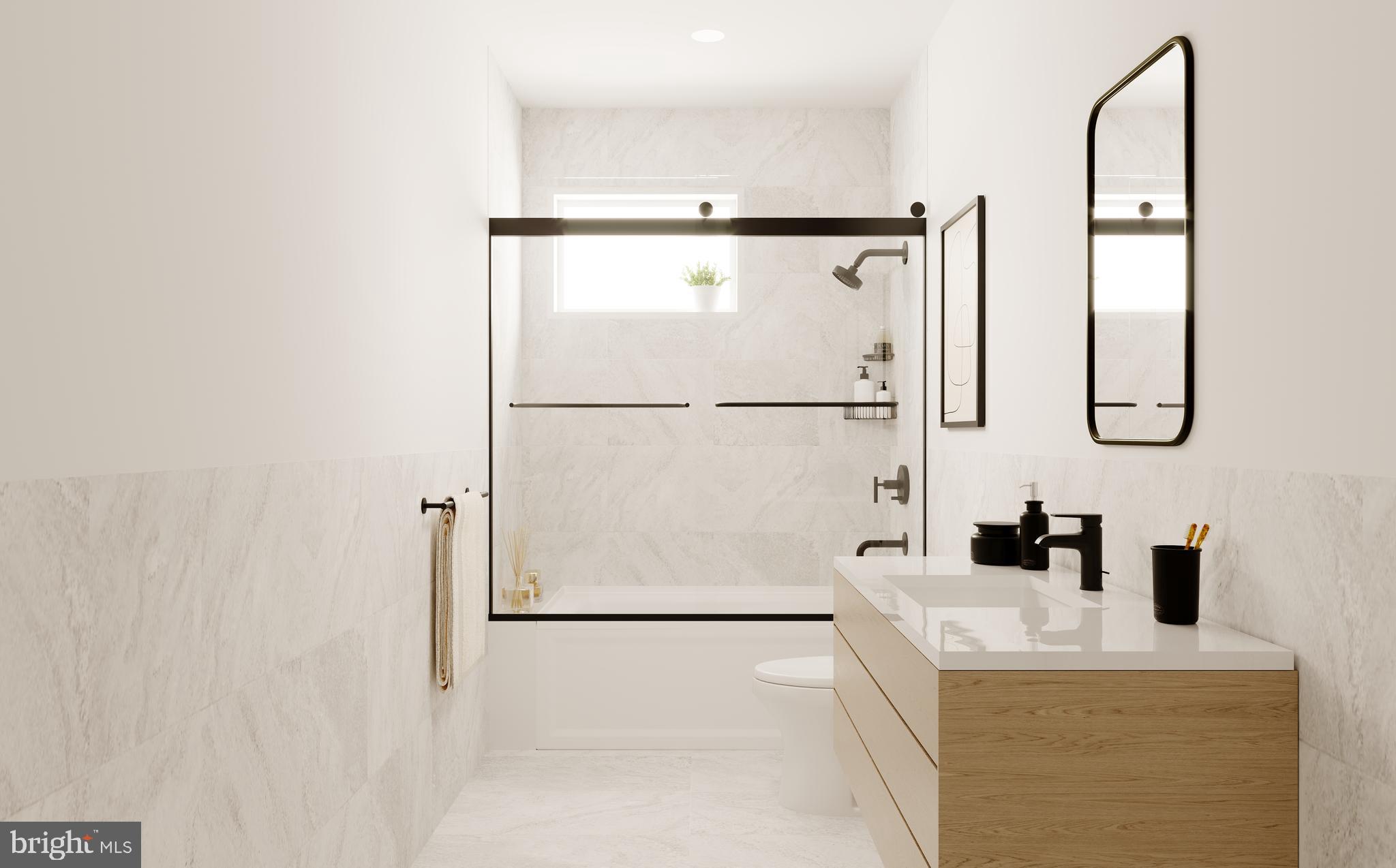 9-2 Walnut Ridge Road Wilmington, DE 19807 - Photo 13 of 13 a bathroom with a sink a mirror and shower