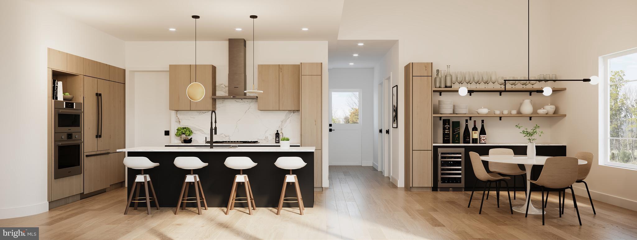 9-2 Walnut Ridge Road Wilmington, DE 19807 - Photo 9 of 13 a kitchen with stainless steel appliances kitchen island granite countertop a table and chairs in it