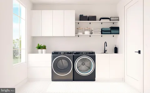 a kitchen with kitchen island white cabinets and sink