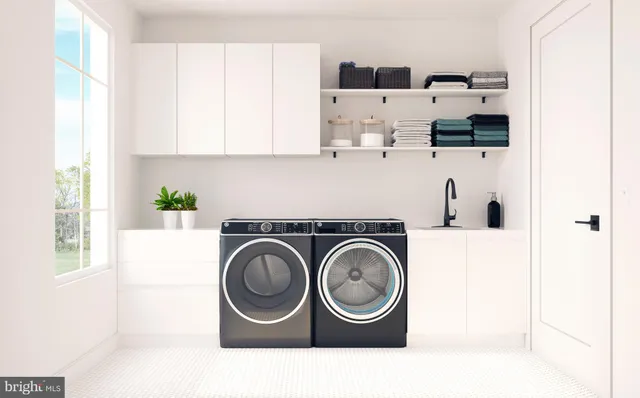 a kitchen with kitchen island white cabinets and sink
