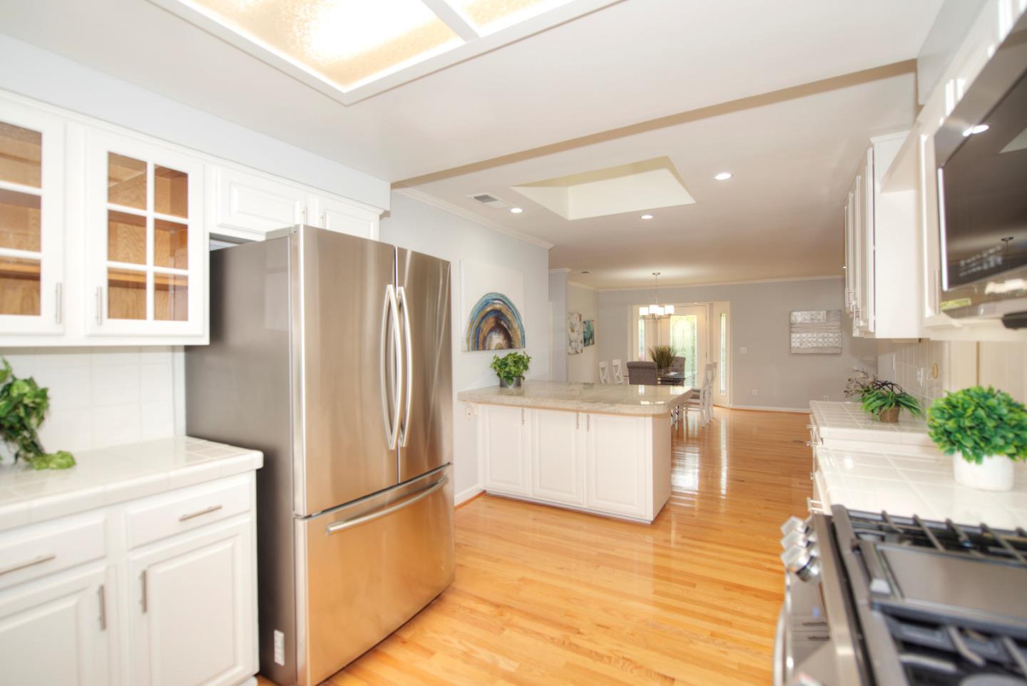 1396 Fallen Leaf Drive Milpitas, CA 95035 - Photo 12 of 43 a kitchen with stainless steel appliances a refrigerator and a stove