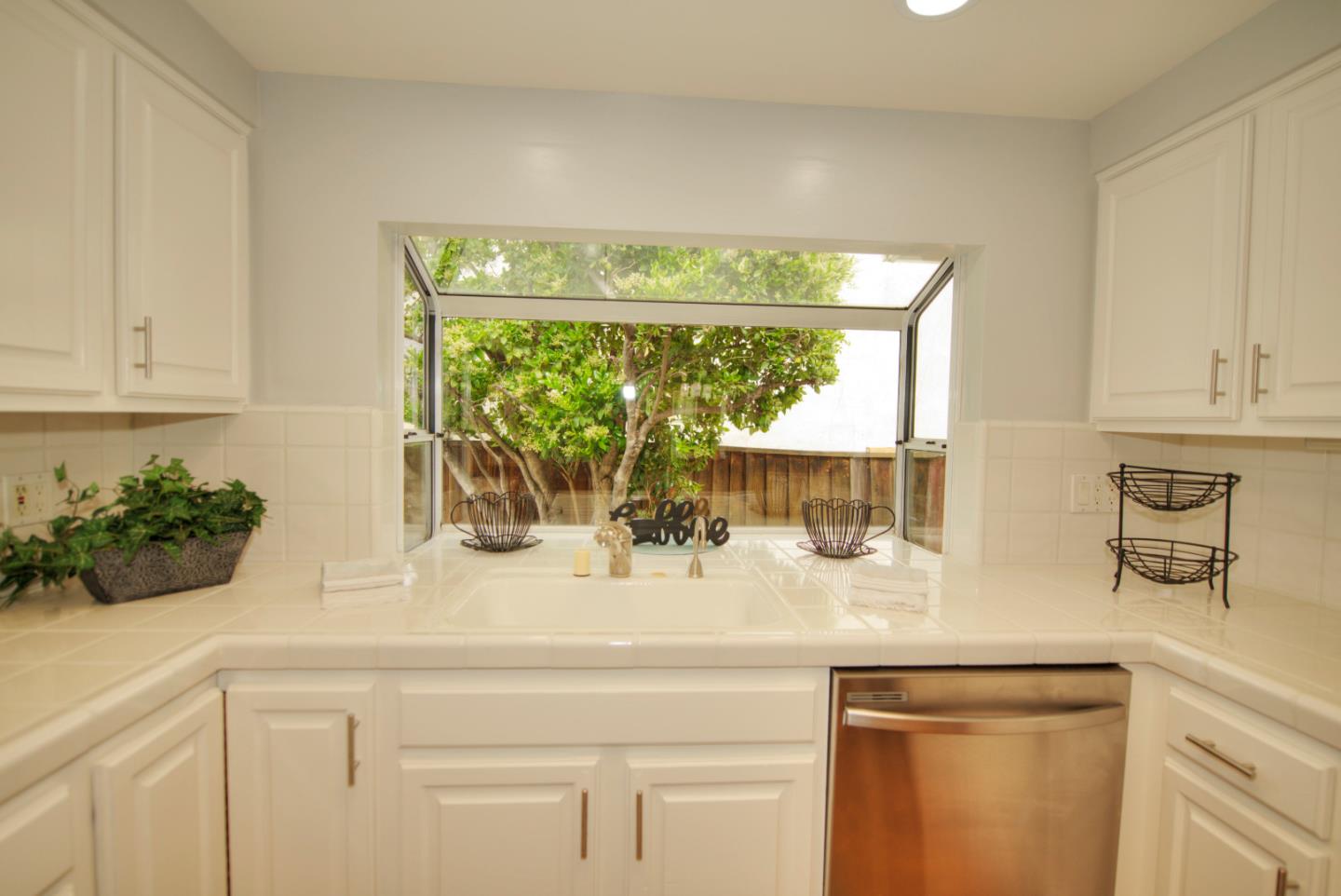 1396 Fallen Leaf Drive Milpitas, CA 95035 - Photo 13 of 43 a kitchen with a sink and cabinets