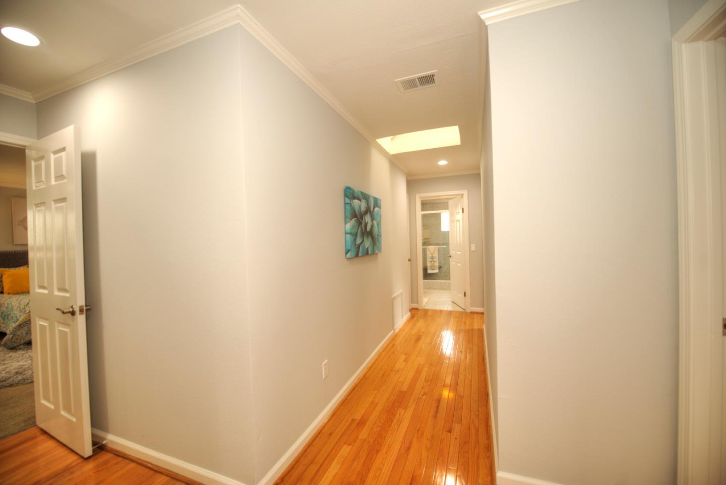 1396 Fallen Leaf Drive Milpitas, CA 95035 - Photo 17 of 43 a view of a hallway with wooden floor