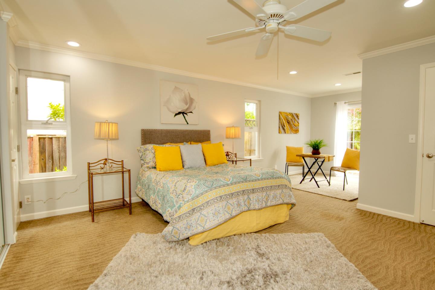 1396 Fallen Leaf Drive Milpitas, CA 95035 - Photo 19 of 43 a spacious bedroom with a bed and ceiling fan