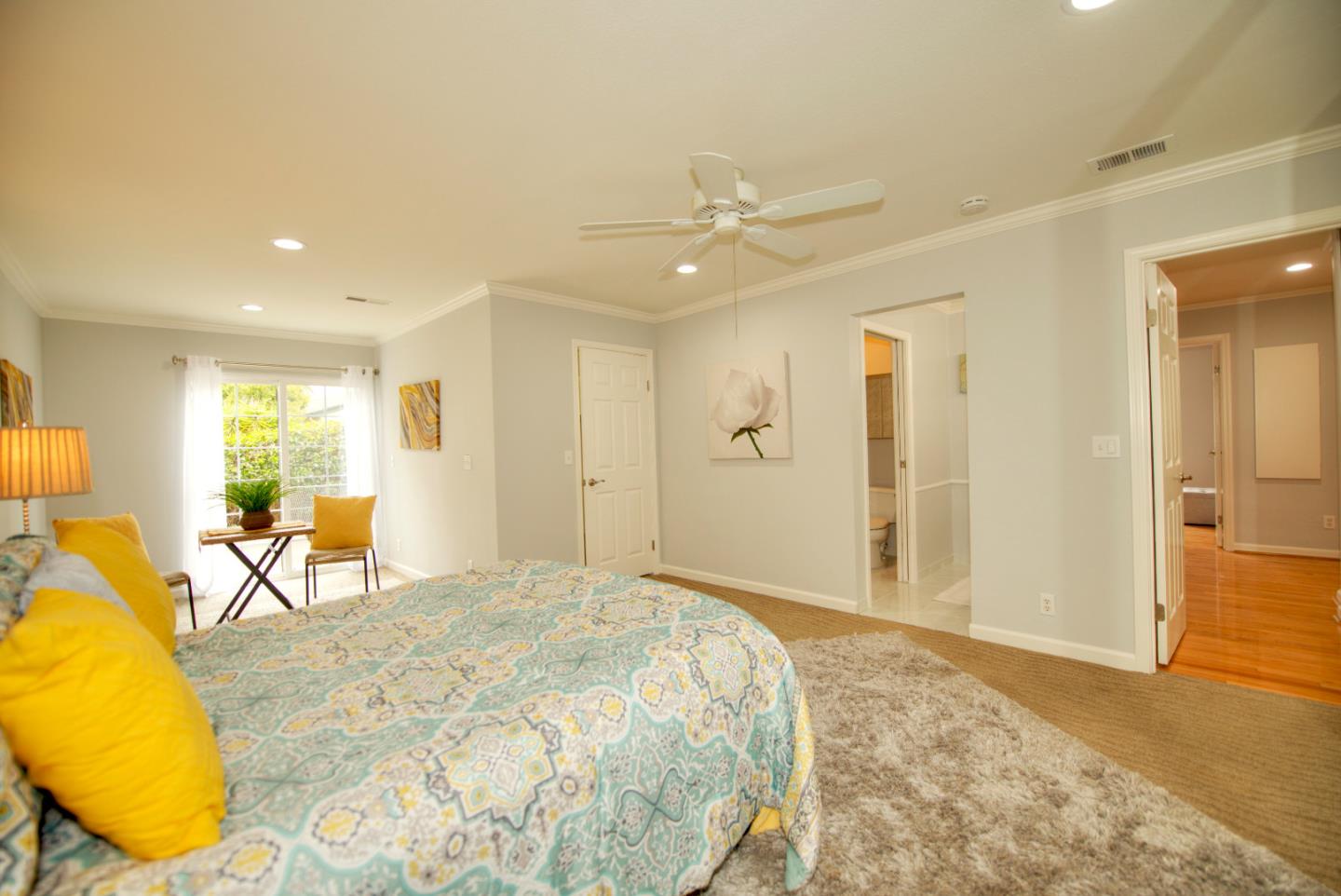 1396 Fallen Leaf Drive Milpitas, CA 95035 - Photo 20 of 43 a bedroom with a bed and wooden floor