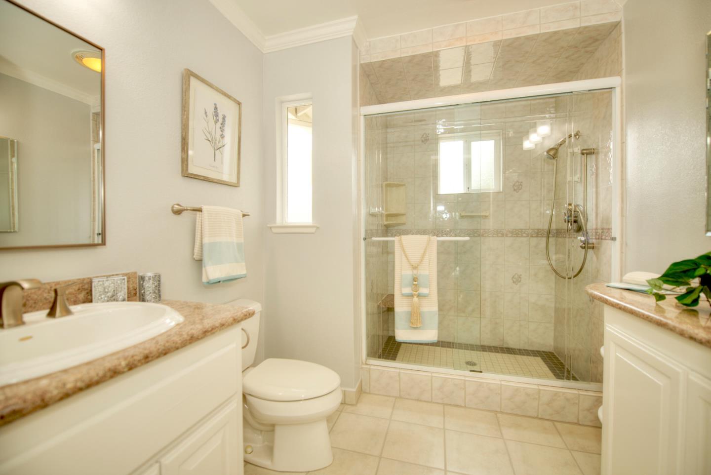 1396 Fallen Leaf Drive Milpitas, CA 95035 - Photo 28 of 43 a bathroom with a granite countertop sink toilet and shower