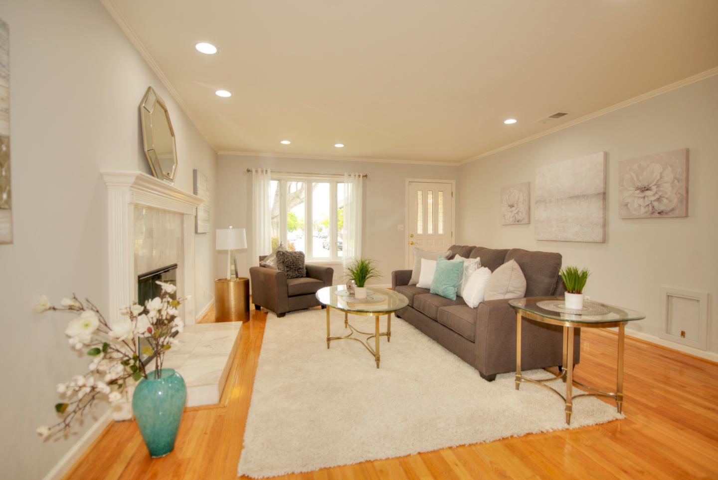 1396 Fallen Leaf Drive Milpitas, CA 95035 - Photo 3 of 43 a living room with furniture and a fireplace